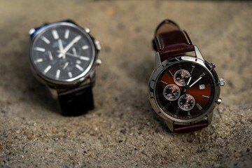 Daylight Saving Time (clock): Two stylish business watches with different time settings to represent the time change. It's not long until the summer/winter time change will happen