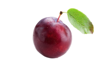 Luscious red plum resting on a clean surface with a dew-kissed leaf in bright light