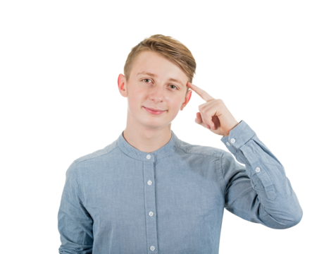 Clever teenage guy portrait pointing forefinger to his temple as looks to camera with confidence. Contented young man adolescent portrait isolated on transparent background
