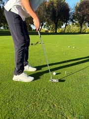 golfer putting on the green