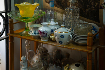 various porcelain and glassware sold at a flea market