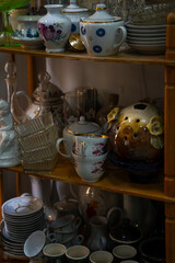 various porcelain and glassware sold at a flea market
