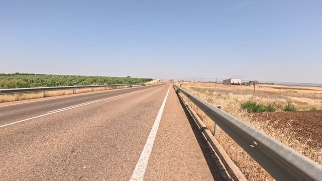 EX-346 paved road approaching Don Benito, province of Badajoz, Extremadura, Spain