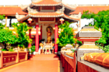 Vibrant asian temple with red roof and decorative architecture in sunlight