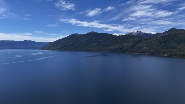 4K Aerial Drone Footage Panning Over a Lake Toward Villarrica Volcano