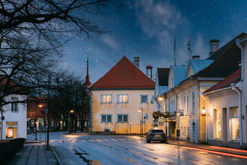 Kuressaare, Estonia. Building Of Noble Assembly And Kuressaare Town Hall At Lossi Street In Evening Or Night Illuminations