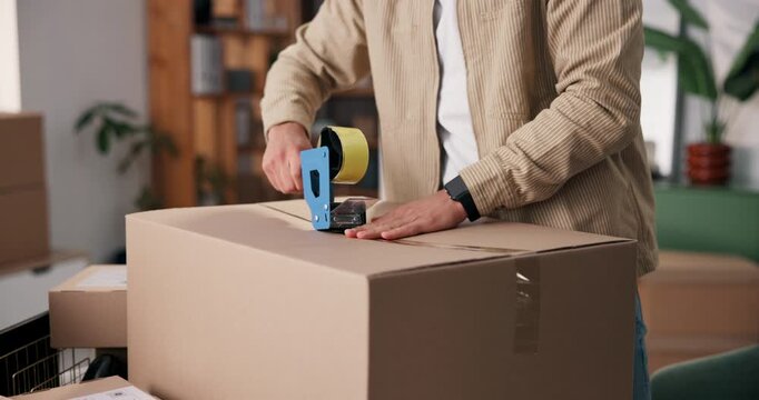 Person, hands and tape with box for logistics, courier service or packaging in small business. Distributor, supplier or cargo with seal for delivery order, safety or security of merchandise in home