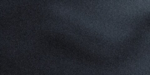 Dark gray sandpaper texture background displaying abstract grunge pattern with fine grain and rough surface