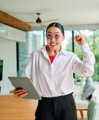 Portrait of asian real state agent female standing in new property apartment or house, or a...