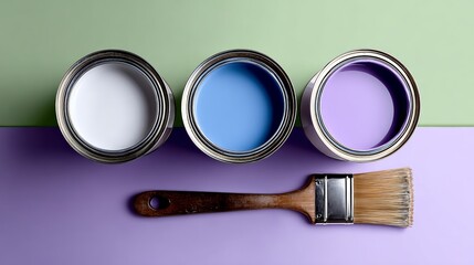 Three cans of paint are displayed on a table, with a paintbrush next to them. The colors of the paint are white, blue, and purple. Concept of creativity and artistic expression, as the paint cans
