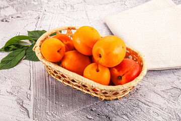 Raw ripe sweet apricots heap