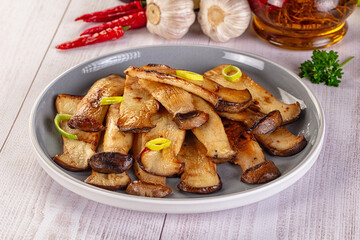 Roasted eringi mushrooms in the plate