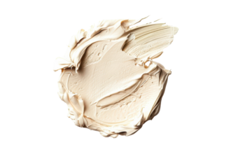 A creamy swatch of soft beige paint spread artistically on a white surface in natural light
