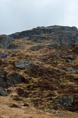 Misty foggy hills mountains in Scotland dramatic landscape hiking tourism active hillwalking