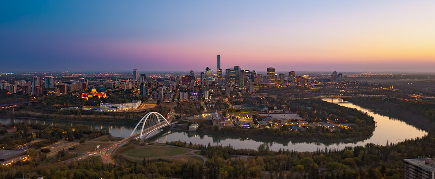Panoramic aerial sunrise view of Edmonton skyline and Walterdale Bridge
