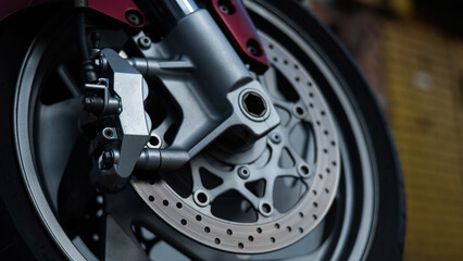 Fototapeta premium Close-up of a red motorcycle wheel. 