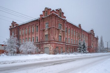 Historic Brick School Building Covered in Snow During Winter in Berdsk, Siberia, Russia