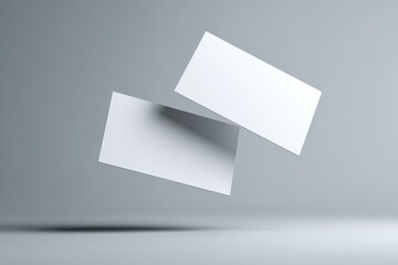 Fototapeta premium Three-Dimensional Business Card Mockup Template for Branding and Identity on a Neutral Grey Background