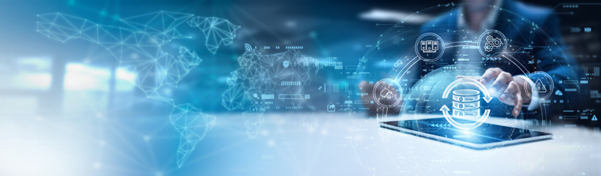 Businessman using tab and analysis backup data. cloud storage solutions, disaster recovery systems, automated data replication, secure server restoration, continuous business continuity