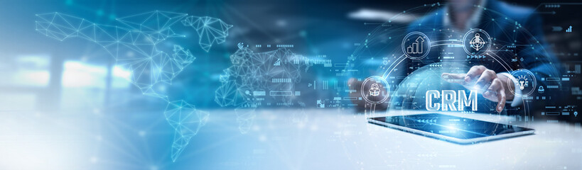 Businessman using tab and analysis CRM data. customer lifecycle management, personalized engagement...