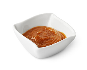 Plum sauce in bowl isolated on white background