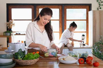 A mother prepares breakfast for her daughter, who is waiting intently.