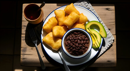 Delicious Fried Dough, Beans, Avocado, And Tea, Placed Beautifully On A Wooden Table