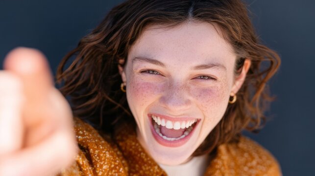 Radiant joy of young Caucasian female, freckles aglow, laughter sparks International Day of Happiness, whimsical spirit vibes