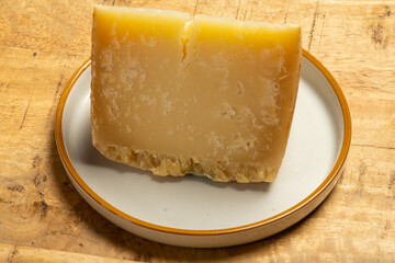 Italian Rodez hard cheese produced with raw cow’s milk, riped 6 months, cheese tasting in Italy