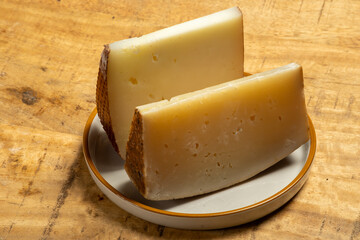Pieces of hard matured Italian cheese pecorino made from sheep's milk, old cheeses of Italy