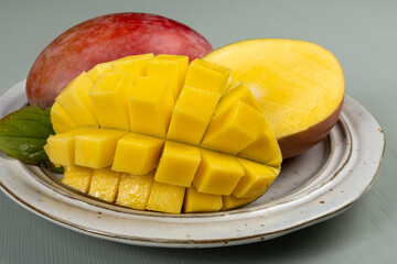 Fresh ripe tropical fruits mango, exotic sweet dessert, juice, healthy food