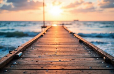Obraz premium Sunset over a wooden pier extending into the ocean with waves and a colorful sky