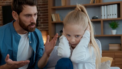Caucasian family problem angry father yelling argument to sad daughter closing ears ignoring dad...