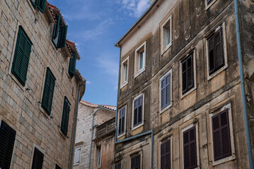 Obraz premium Historic stone buildings with window shutters