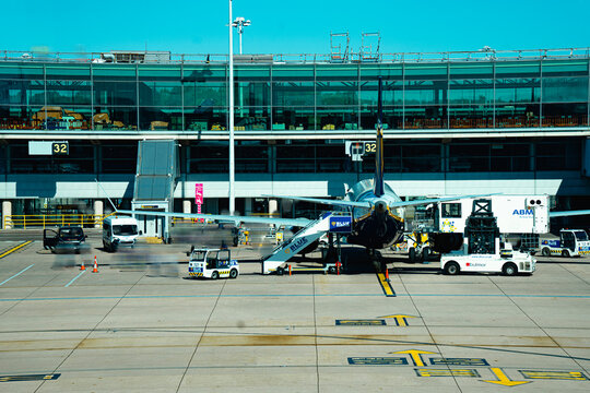 Passenger Jet, Blue Handling Ground Handling Agent (GHA) Company Logo, Aircraft Parked On Tarmac, Stansted Airport Apron, Essex, London, England, United Kingdom - September 2025