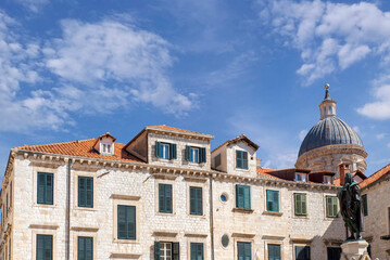 Historic stone buildings with window shutters © Sergey