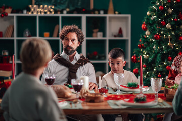 Family celebrating christmas dinner at home