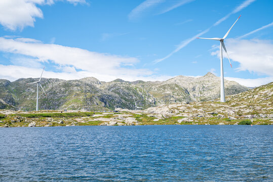 Beautiful landscape with lake and windmills on top of the Gotthard pass in Swiss