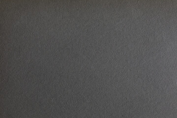 Gradient black paper texture with grains surface