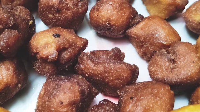 Authentic Bangladeshi Winter Pitha Treats &ndash; Homemade Mix of Sweet and Spicy Delicacies such as Taler Bora, Puli, and Singara Pitha Served on Tray