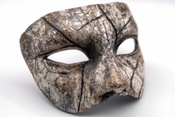 Stone mask with cracks a textured and weathered face covering isolated on white background