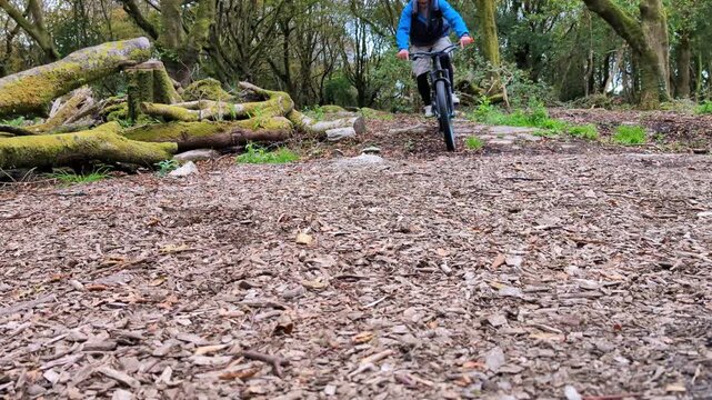 Mountain Biker Riding in Barna Woods Galway Ireland Extreme Sports Adventure in Autumn Forest Trail Fitness Outdoor Cycling