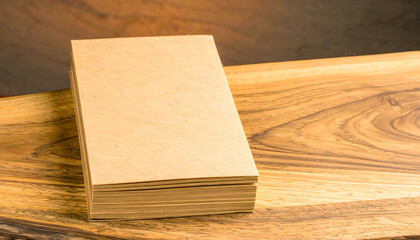 Fototapeta premium Stack of Blank Notebooks on a Wooden Table Surface