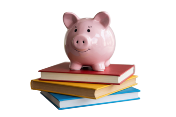 A pink piggy bank sits atop a stack of colorful books, symbolizing education savings and financial literacy. background removed
