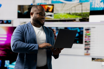 Young black person showcasing visual representation of online connection, immersed in web platforms...