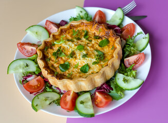 Close-up of Shortcrust Pastry Cheese and Onion Quiche with Cheddar Cheese and Summer Salad, British Savoury Cuisine