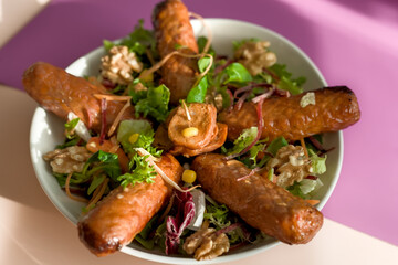 Close-up of Spicy Grilled Chorizo Spanish Paprika Sausages with Summer Walnut Healthy Salad
