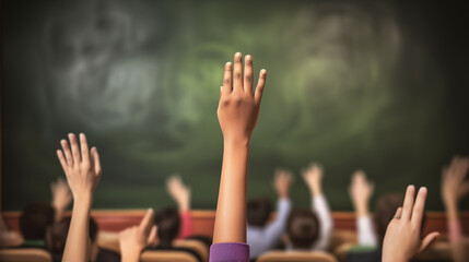 Students raising hands in front of a blurred blackboard in a school classroom. Back to school 