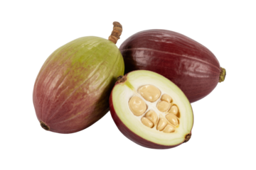 Two whole and one halved Buah Merah fruits, showcasing their vibrant reddish-purple and greenish hues and creamy interior seeds. background removed