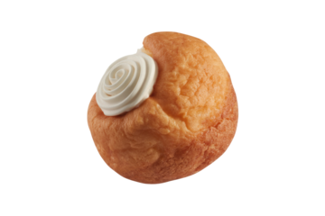 A delectable cream puff, light and airy, topped with a swirl of whipped cream. background removed